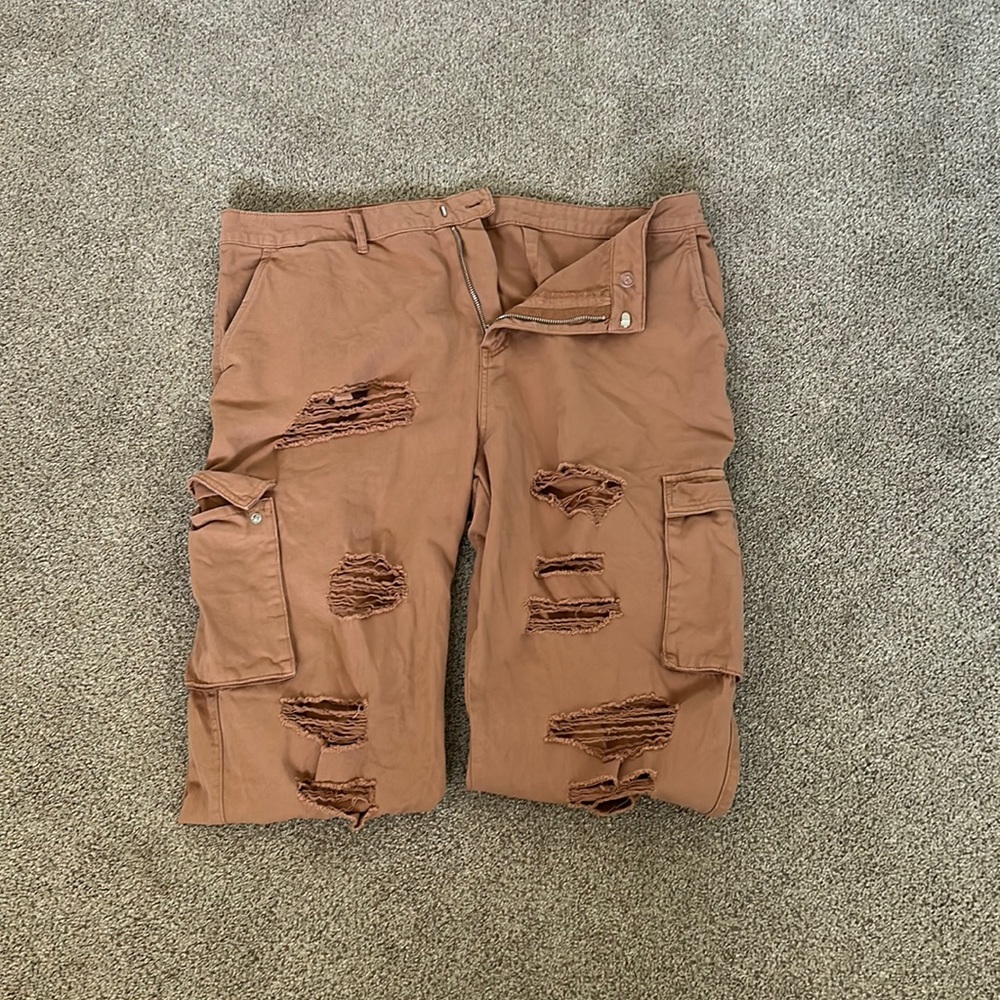 Peach colored ripped cargo joggers
